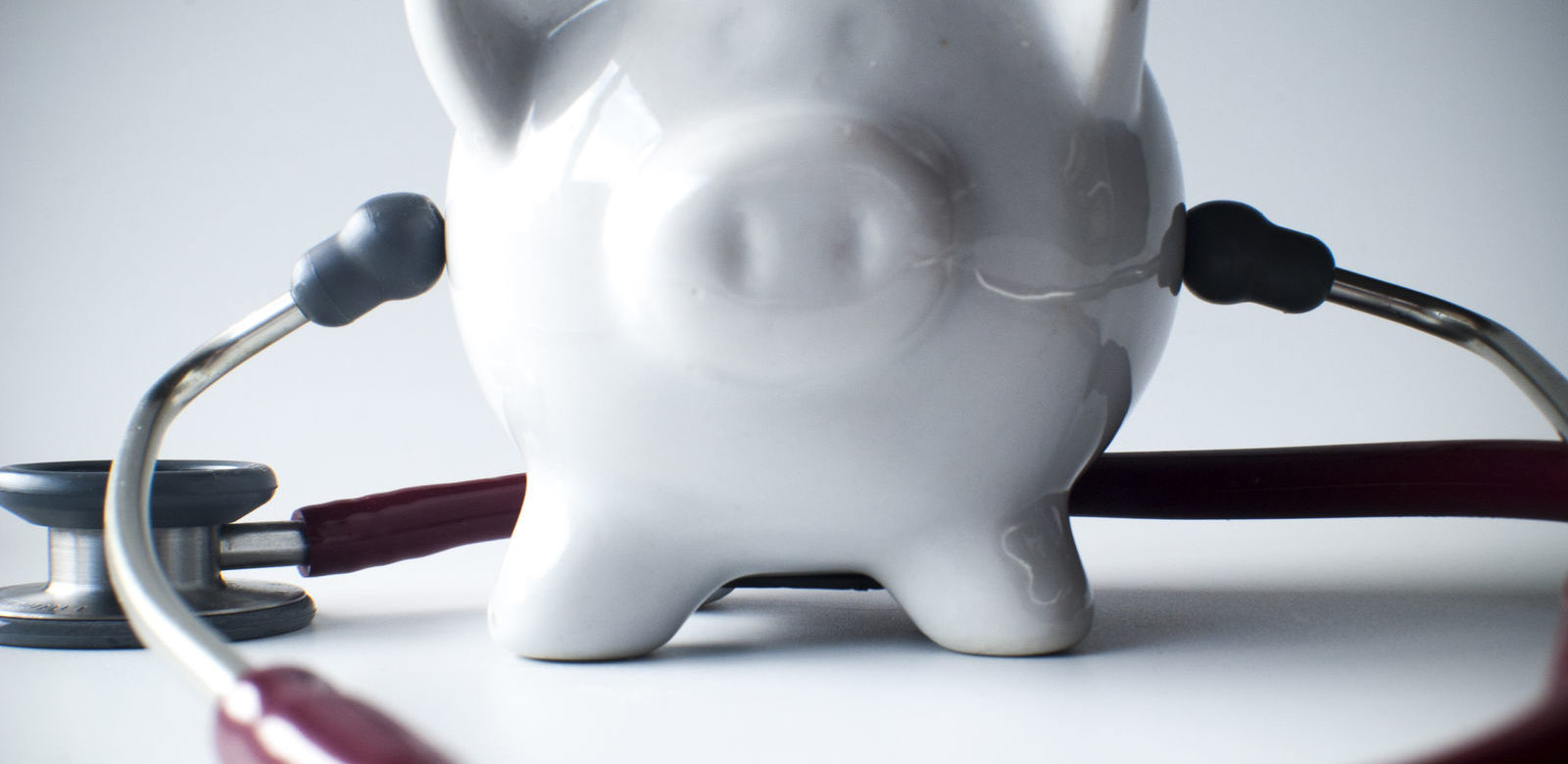 A piggybank with a stethoscope