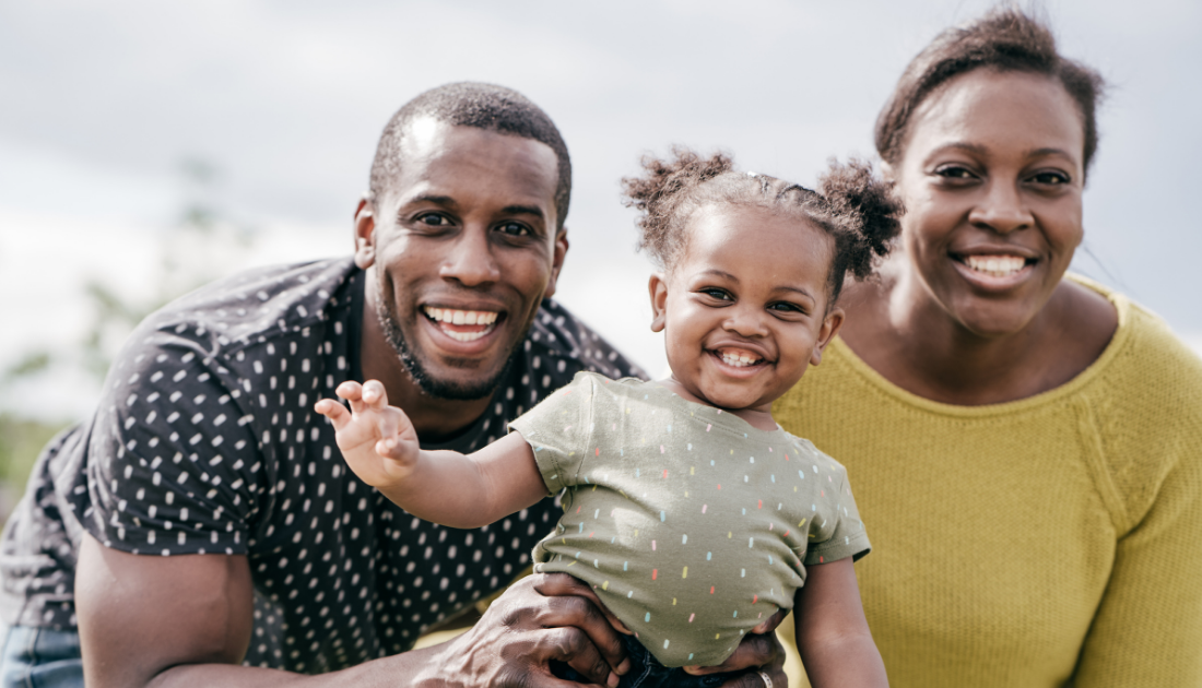 Happy family of color smiles and celebrates together